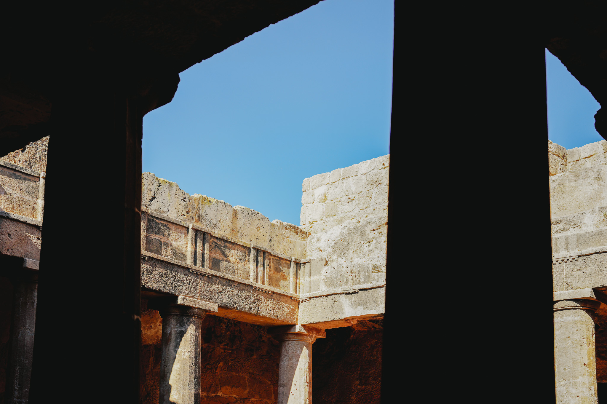 Doric columns inside the Tombs of the Kings in Paphos