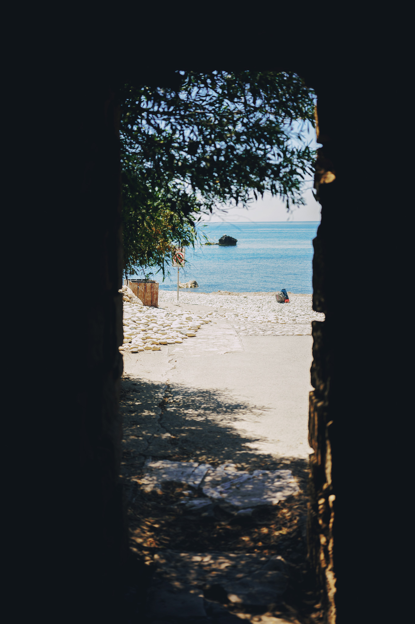 Tunnel exit leading to Aphrodite's Rock beach