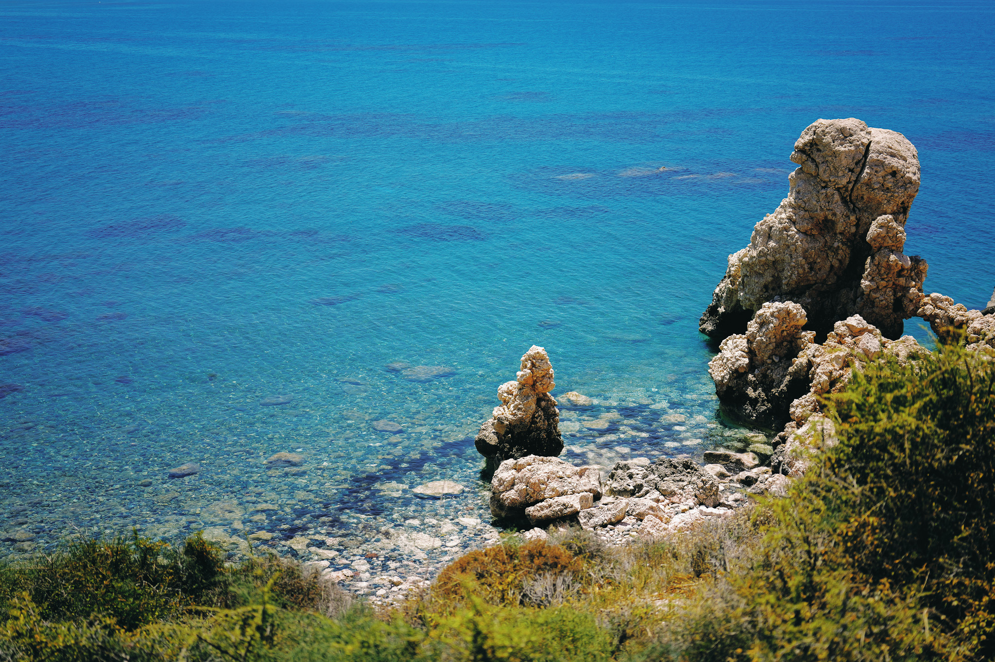 Blue Mediterranean water around Aphrodite's Rock